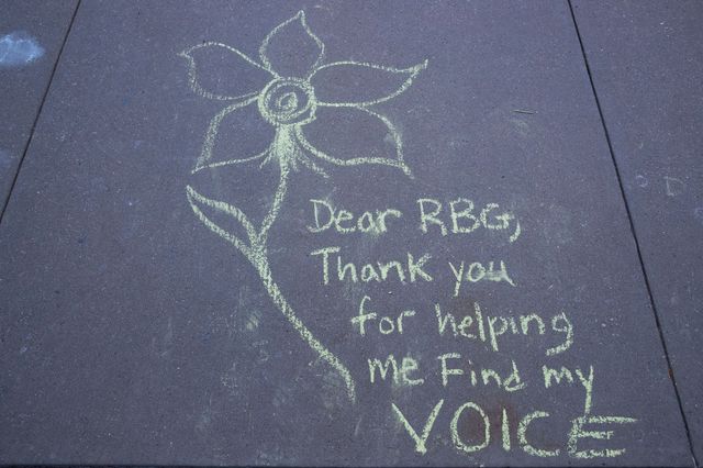 A message is left in chalk on the sidewalk to honor the late US Justice Ruth Bader Ginsburg, outside the Supreme Court in Washington, D.C.